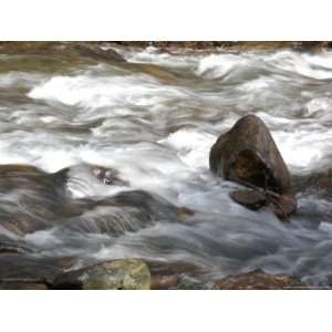  Whitewater Rushes Over Rocks in a River in Montana Premium 