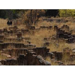  Tourists Walk Among Ruins at Bandelier National Monument 