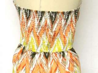  strapless dress in a beautiful and unique print. Shades of orange 