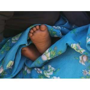 Childs Feet Wrapped with Sari at Kunbuli Friday Market, Orissa, India 