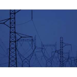 Silhouette of Towers with High Voltage Power Lines at Twilight 