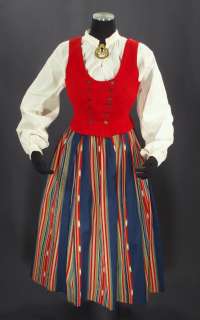   womans folk costume from Ilmajoki ikat skirt blouse brooch vest