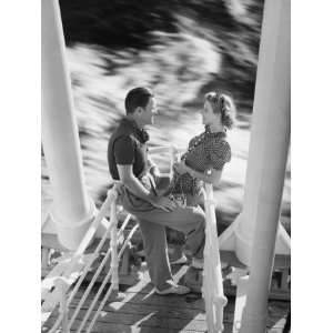 Young Couple Standing at Railing on Cruiser Deck, Elevated 