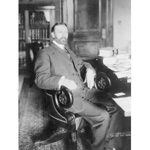  1910 photo George Sutherland, full length portrait, seated 