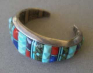 Zuni artist Lloyd Tsalabuties silver bracelet cuff with inlays of 