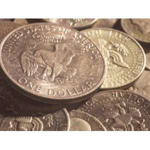 of American Silver Dollar Coin with Eagle on its Face with Other Coins 